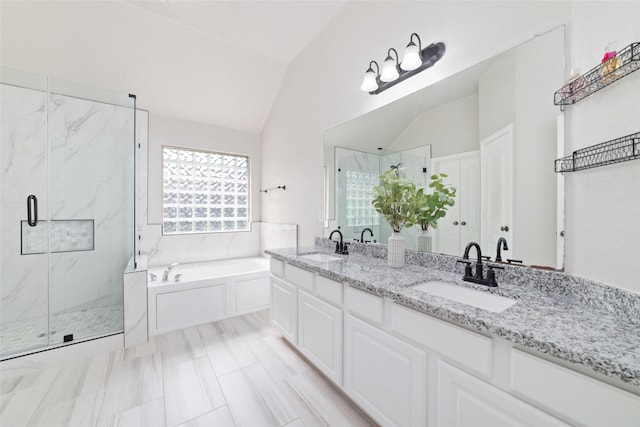 1706 Maddie Springs Ct, Spring, TX 77386 - bathroom featuring lofted ceiling, a garden tub, a marble finish shower, and double vanity