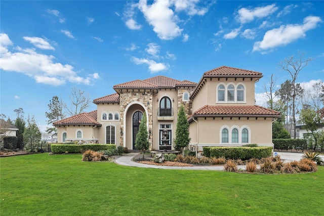 4510 Siandra Creek Ct, Spring, TX 77386 - mediterranean / spanish-style home featuring stucco siding, a front lawn, and a tiled roof