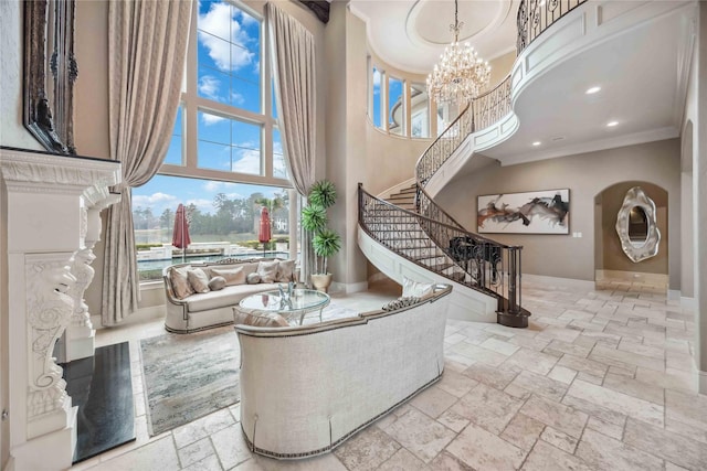 4510 Siandra Creek Ct, Spring, TX 77386 - living area with ornamental molding, stone tile flooring, stairs, a towering ceiling, and a premium fireplace