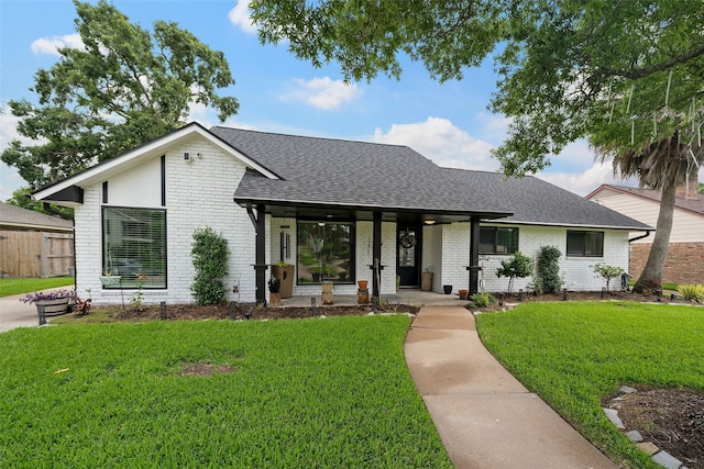 918 Hollow Tree St, La Porte, TX 77571 - view of front of house featuring brick siding, a shingled roof, and covered porch