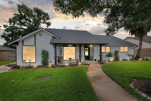 918 Hollow Tree St, La Porte, TX 77571 - view of front of house with brick siding, a shingled roof, and a porch