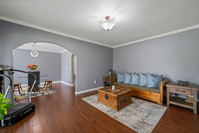 918 Hollow Tree St, La Porte, TX 77571 - living room featuring arched walkways, ornamental molding, wood finished floors, and baseboards