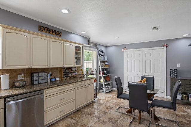918 Hollow Tree St, La Porte, TX 77571 - kitchen featuring stainless steel dishwasher, cream cabinets, backsplash, crown molding, and recessed lighting