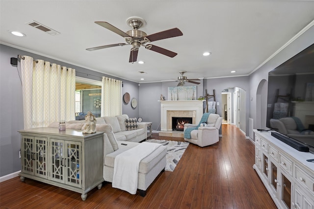 918 Hollow Tree St, La Porte, TX 77571 - living area featuring ceiling fan, arched walkways, dark wood-type flooring, ornamental molding, and recessed lighting