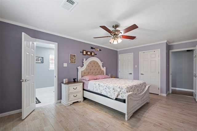 918 Hollow Tree St, La Porte, TX 77571 - bedroom featuring baseboards, light wood-style floors, crown molding, multiple closets, and ceiling fan
