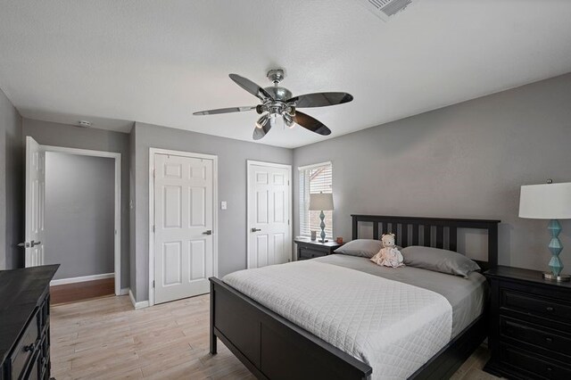 918 Hollow Tree St, La Porte, TX 77571 - bedroom featuring light wood finished floors, baseboards, and ceiling fan
