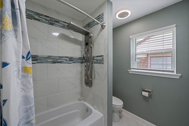 918 Hollow Tree St, La Porte, TX 77571 - bathroom featuring toilet, shower / bath combination with curtain, and baseboards