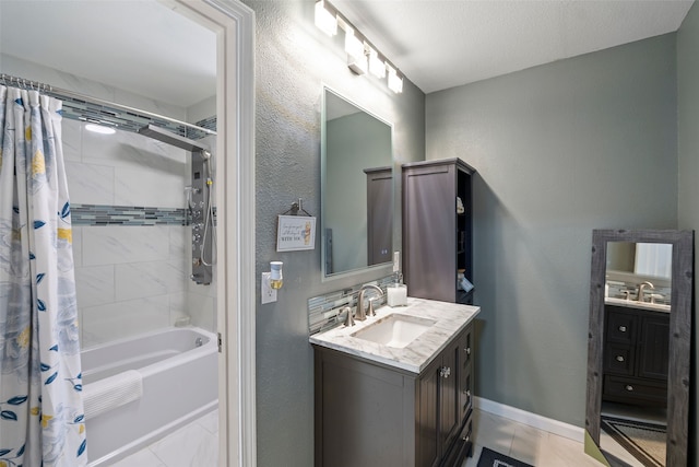 918 Hollow Tree St, La Porte, TX 77571 - bathroom with vanity, shower / bath combination with curtain, baseboards, and a textured wall