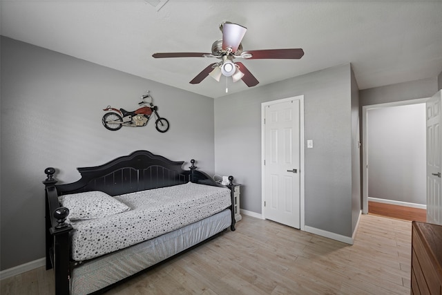 918 Hollow Tree St, La Porte, TX 77571 - bedroom featuring baseboards, wood finished floors, and ceiling fan
