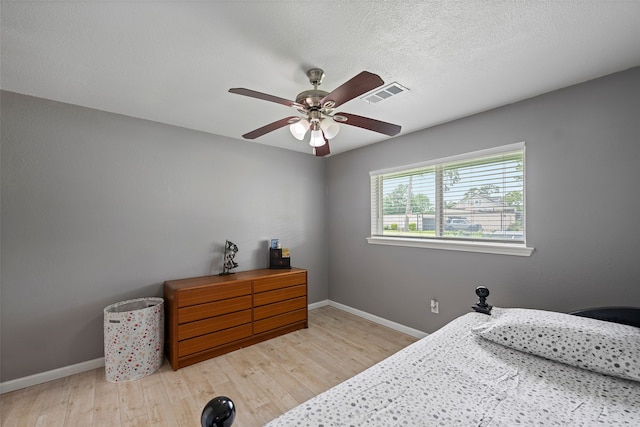 918 Hollow Tree St, La Porte, TX 77571 - bedroom with wood finished floors, baseboards, and a ceiling fan
