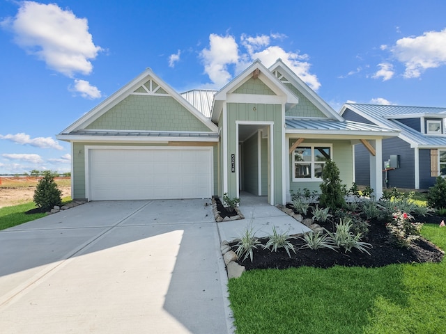 5218 Allen Cay, Texas City, TX 77590 - craftsman inspired home with a garage, concrete driveway, a standing seam roof, and metal roof
