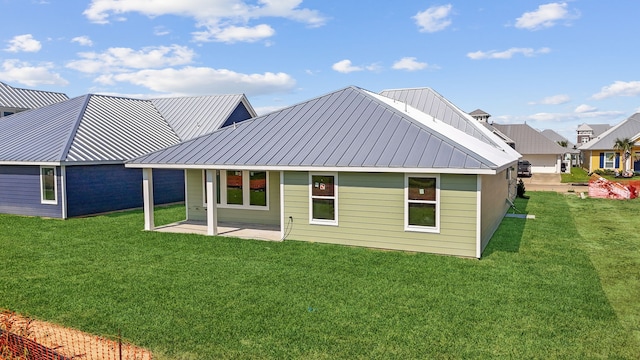5218 Allen Cay, Texas City, TX 77590 - back of property with a yard, metal roof, and a patio