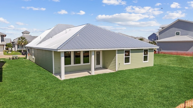 5218 Allen Cay, Texas City, TX 77590 - rear view of property with a lawn, a patio area, and metal roof