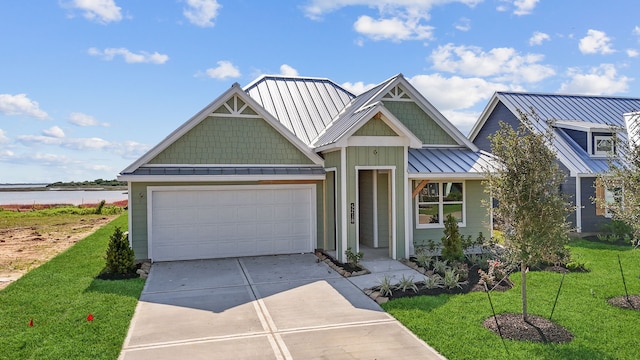 5218 Allen Cay, Texas City, TX 77590 - craftsman house with a front yard, an attached garage, driveway, a standing seam roof, and metal roof