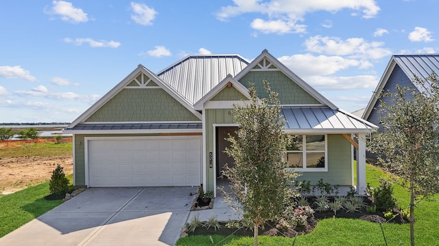 5218 Allen Cay, Texas City, TX 77590 - view of front of home featuring a standing seam roof, metal roof, and a garage