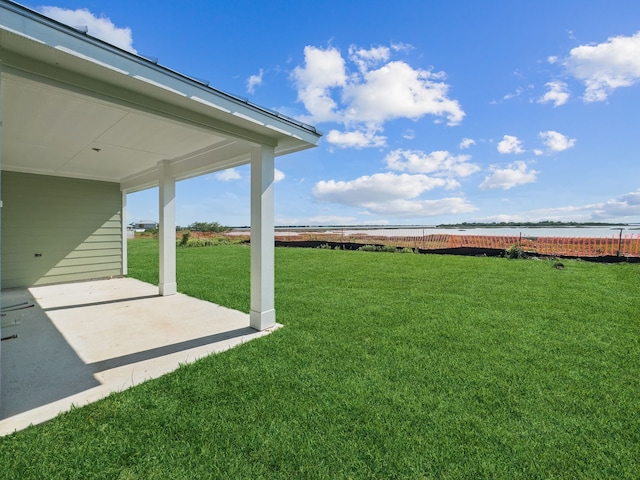 5218 Allen Cay, Texas City, TX 77590 - view of grassy yard with a water view and a patio area