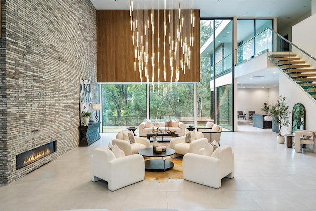 11206 Tyne Ct, Houston, TX 77024 - building lobby featuring a high ceiling, floor to ceiling windows, and stairs