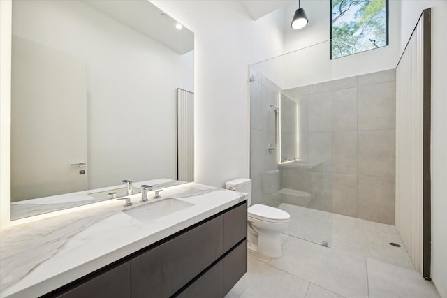 11206 Tyne Ct, Houston, TX 77024 - bathroom with toilet, a walk in shower, tile patterned flooring, and vanity