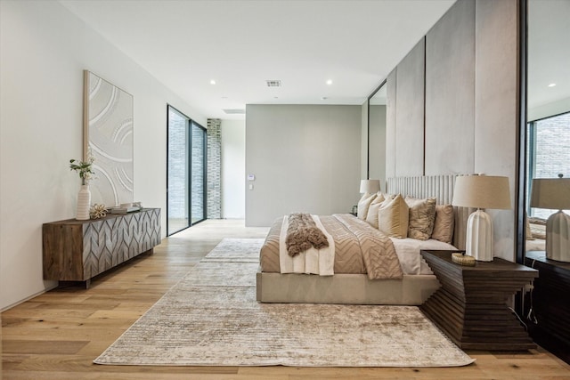 11206 Tyne Ct, Houston, TX 77024 - bedroom featuring light wood finished floors and recessed lighting