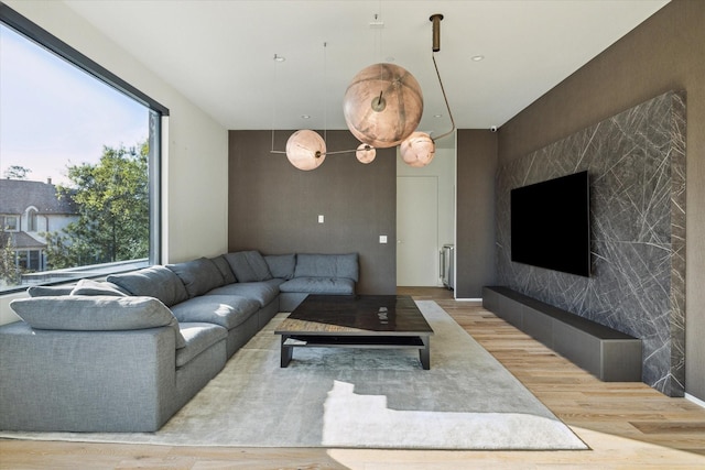 11206 Tyne Ct, Houston, TX 77024 - living room featuring an accent wall and wood finished floors