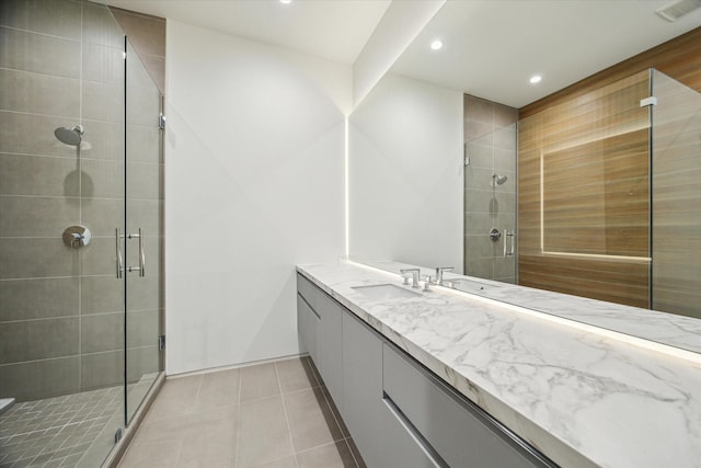 11206 Tyne Ct, Houston, TX 77024 - bathroom featuring recessed lighting, a stall shower, vanity, tile patterned floors, and baseboards