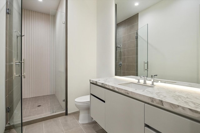 11206 Tyne Ct, Houston, TX 77024 - bathroom with tile patterned flooring, a shower stall, vanity, and recessed lighting