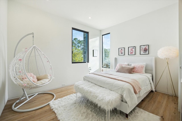 11206 Tyne Ct, Houston, TX 77024 - bedroom with wood finished floors and recessed lighting