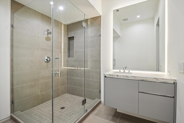 11206 Tyne Ct, Houston, TX 77024 - bathroom with tile patterned flooring, a stall shower, vanity, and recessed lighting