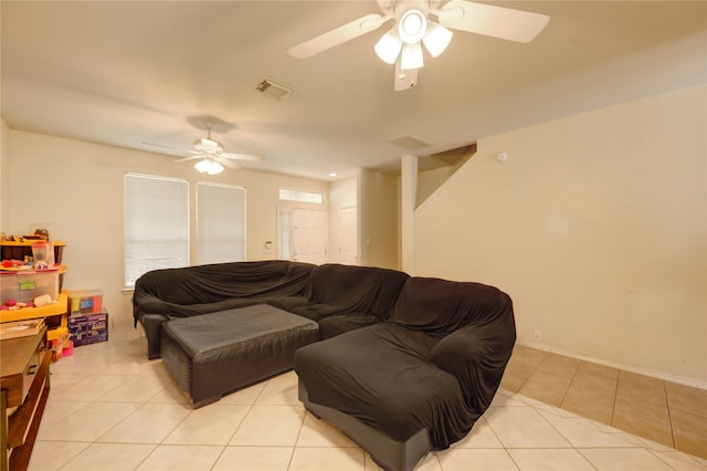 23610 Youpon Lake Ln, Spring, TX 77373 - living room with a ceiling fan, light tile patterned floors, and baseboards
