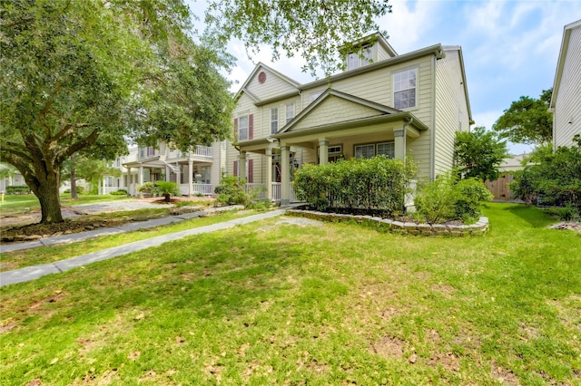 23610 Youpon Lake Ln, Spring, TX 77373 - view of front facade with a front yard and covered porch