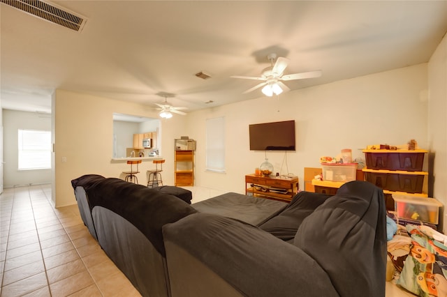 23610 Youpon Lake Ln, Spring, TX 77373 - living room with light tile patterned floors and a ceiling fan