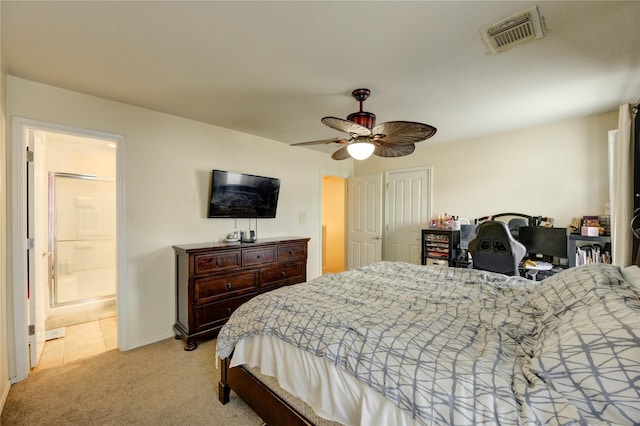 23610 Youpon Lake Ln, Spring, TX 77373 - bedroom with light carpet, ensuite bathroom, a ceiling fan, and baseboards
