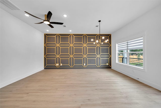 4902 Higgins St B, Unit A, Houston, TX 77033 - spare room with baseboards, recessed lighting, a chandelier, light wood-style flooring, and a ceiling fan