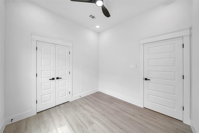 4902 Higgins St B, Unit A, Houston, TX 77033 - unfurnished bedroom with light wood-style floors, baseboards, and a ceiling fan
