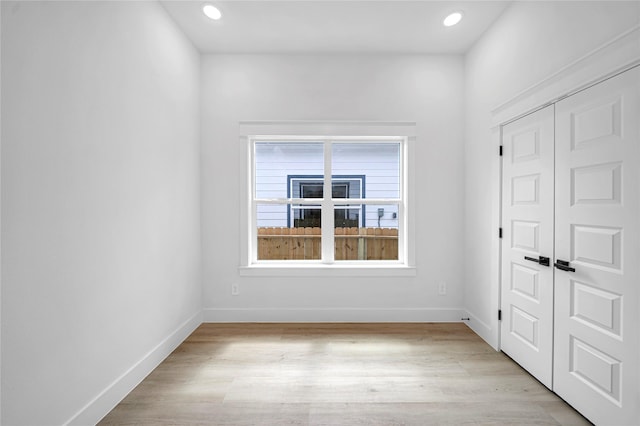 4902 Higgins St B, Unit A, Houston, TX 77033 - unfurnished room featuring baseboards, light wood finished floors, and recessed lighting