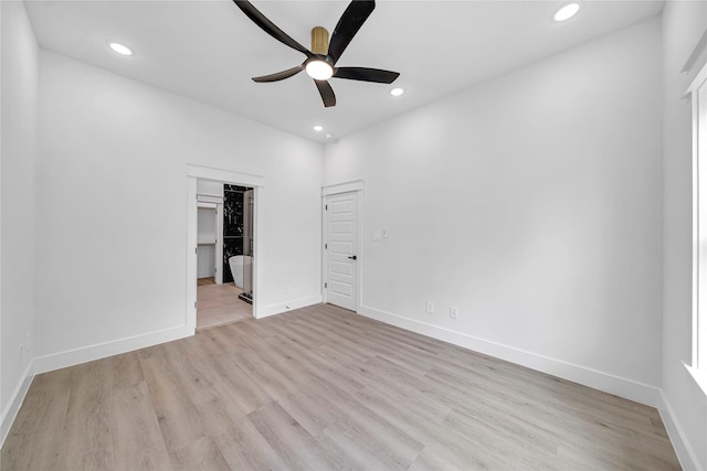 4902 Higgins St B, Unit A, Houston, TX 77033 - unfurnished bedroom with recessed lighting, light wood finished floors, baseboards, and a walk in closet