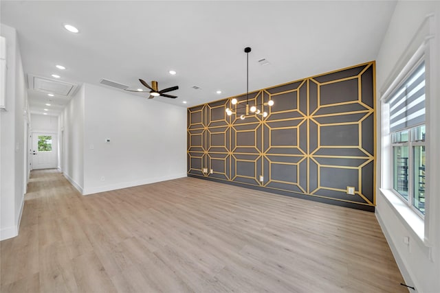 4902 Higgins St B, Unit A, Houston, TX 77033 - unfurnished room with light wood-type flooring, baseboards, an accent wall, a ceiling fan, and recessed lighting