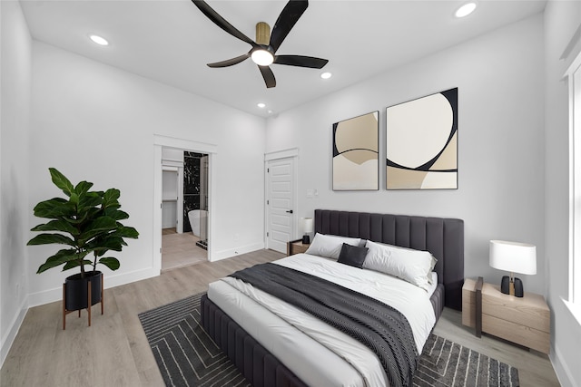 4902 Higgins St B, Unit A, Houston, TX 77033 - bedroom with light wood-style flooring, recessed lighting, baseboards, a ceiling fan, and a walk in closet