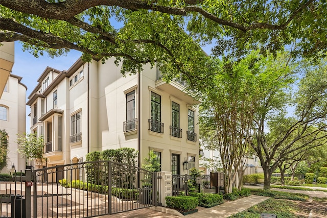 3202 Mid Ln, Houston, TX 77027 - view of front facade featuring a gate and stucco siding