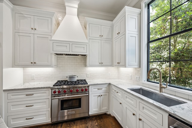 3202 Mid Ln, Houston, TX 77027 - kitchen with appliances with stainless steel finishes, a sink, crown molding, custom range hood, and white cabinets