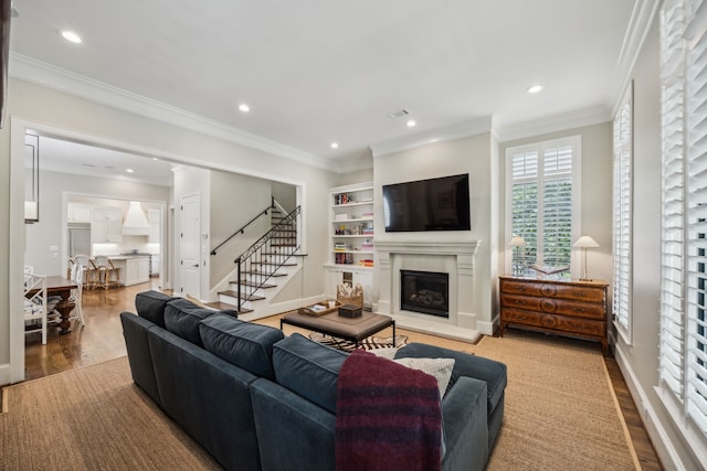 3202 Mid Ln, Houston, TX 77027 - living area featuring a glass covered fireplace, stairway, wood finished floors, recessed lighting, and baseboards