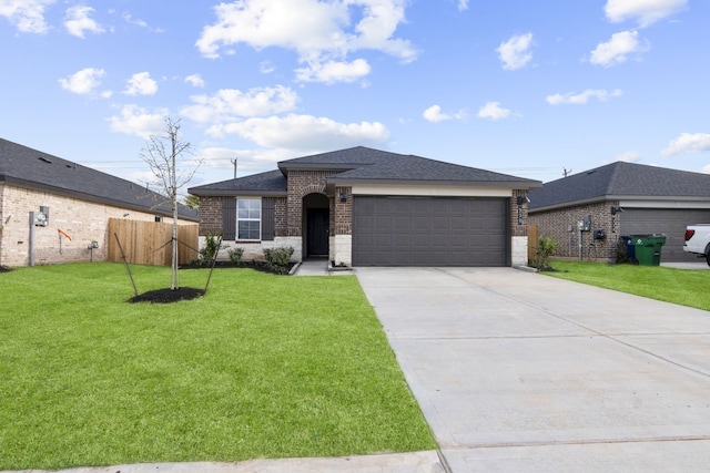 405 Amy St, Angleton, TX 77515 - view of front of property featuring a garage, driveway, brick siding, and roof with shingles