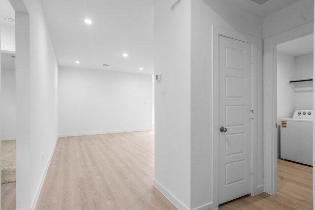 405 Amy St, Angleton, TX 77515 - corridor with washer / clothes dryer, light wood-style flooring, recessed lighting, and baseboards