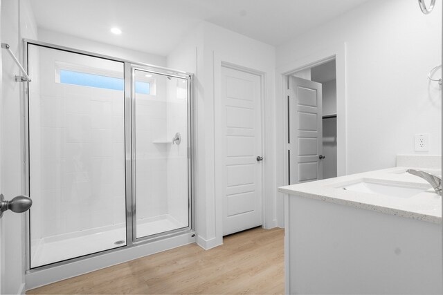 405 Amy St, Angleton, TX 77515 - full bath featuring a stall shower, wood finished floors, recessed lighting, and vanity