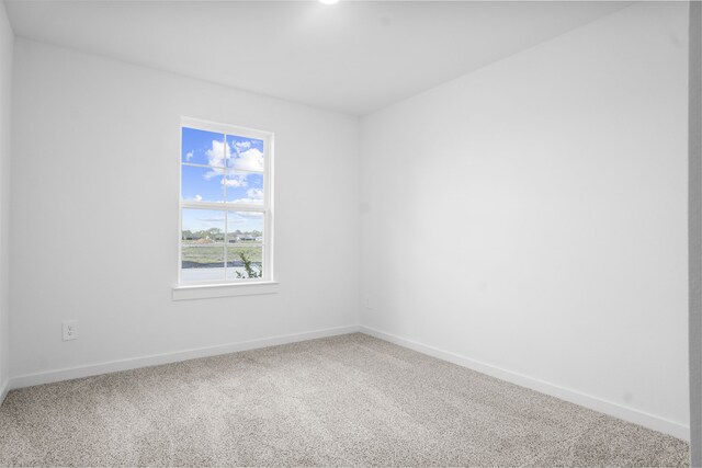 405 Amy St, Angleton, TX 77515 - carpeted spare room with baseboards