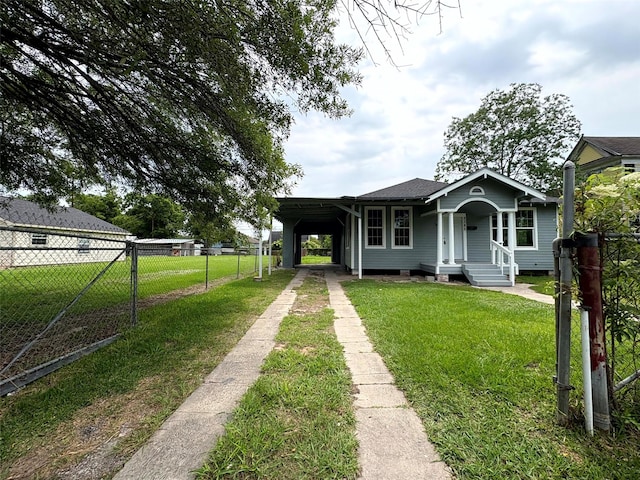 2385 Neches St, Beaumont, TX 77701 - view of front of house with driveway, a carport, and a porch