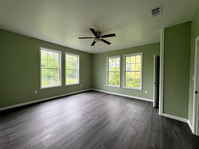 2385 Neches St, Beaumont, TX 77701 - empty room with baseboards, dark wood finished floors, and ceiling fan