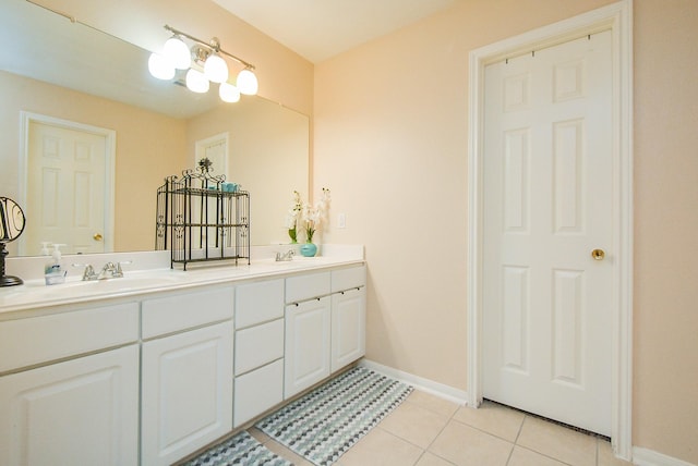 3434 Zephyr Glen Way, Houston, TX 77084 - bathroom with double vanity, baseboards, and tile patterned floors