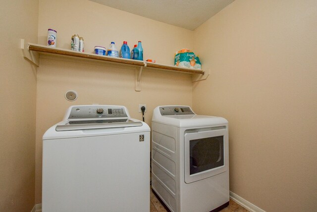 3434 Zephyr Glen Way, Houston, TX 77084 - washroom featuring washing machine and dryer and baseboards