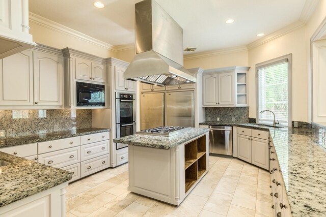 1 Heritage Oak Ct, Lake Jackson, TX 77566 - kitchen with open shelves, built in appliances, a sink, island exhaust hood, and backsplash